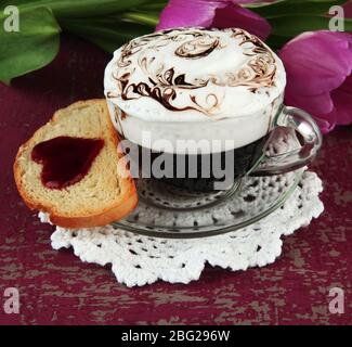 Composition of coffee, toast and tulips on color background Stock Photo