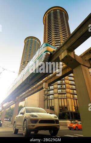 3D rendering of an SUV on motion under the Seattle monorail. Stock Photo