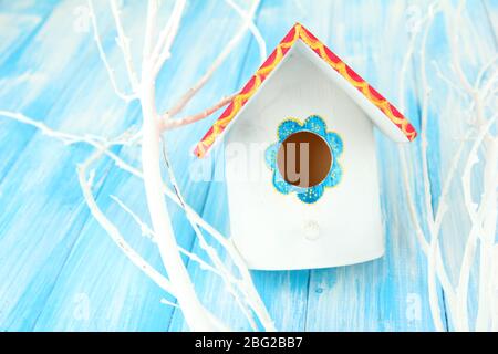 Decorative nesting box on color background Stock Photo