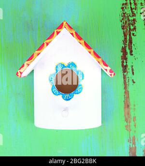 Decorative nesting box on color background Stock Photo