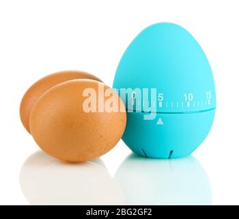 Blue egg timer and eggs, isolated on white Stock Photo