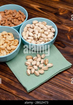 Various nuts in bowls. Nuts assortment. Nuts mix for a healthy diet Stock Photo