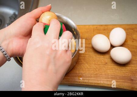 Serial of egg shell bleaching procedure for coloring eggs for Easter Stock Photo
