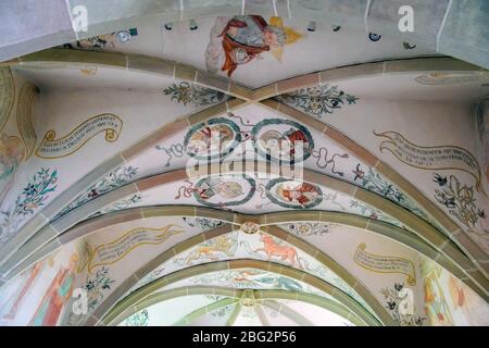 Medieval wall paintings inside St. Martin romanesque church in Kirchbühl near Sempach, Canton Lucerne, Switzerland. Stock Photo