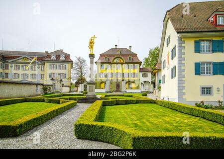 View of the curator in the background and the collegiate houses of St. Johann and St Magdalena Pfund, Beromünster, Switzerland. Stock Photo