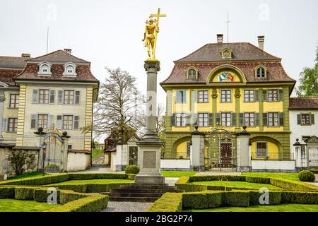 View of the curator in the background and the collegiate houses of St. Johann and St Magdalena Pfund, Beromünster, Switzerland. Stock Photo