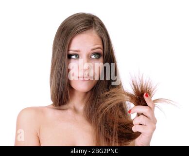 Beautiful woman holding split ends of her long hair, isolated on white Stock Photo