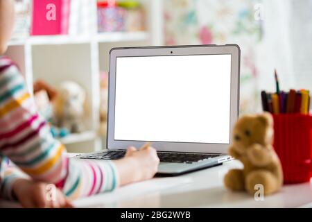Primary school student having video conference call with teacher using webcam. Online education and e-learning concept. Home quarantine distance learn Stock Photo