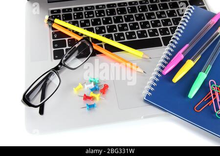 Laptop with stationery isolated on white Stock Photo