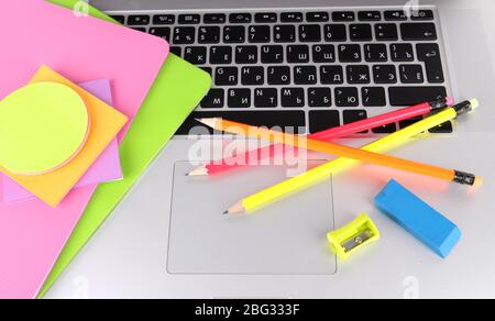 Laptop with stationery close-up Stock Photo
