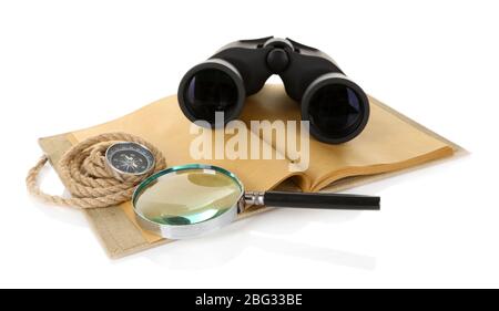 Black modern binoculars with old notebook isolated on white Stock Photo