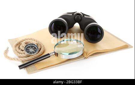 Black modern binoculars with old notebook isolated on white Stock Photo