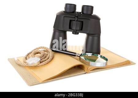 Black modern binoculars with old notebook isolated on white Stock Photo