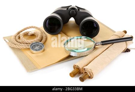 Black modern binoculars with old notebook isolated on white Stock Photo