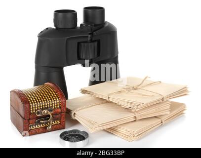 Black modern binoculars with old letters isolated on white Stock Photo