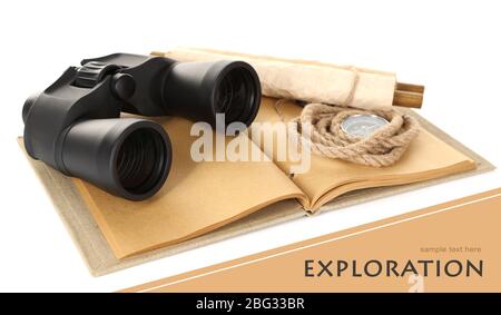 Black modern binoculars with old notebook isolated on white Stock Photo