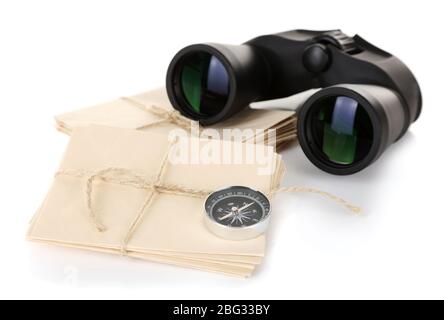 Black modern binoculars with old letters isolated on white Stock Photo