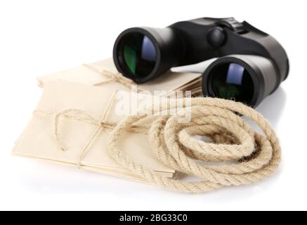 Black modern binoculars with old letters isolated on white Stock Photo