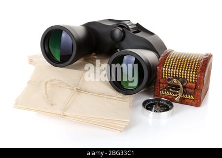 Black modern binoculars with old letters isolated on white Stock Photo
