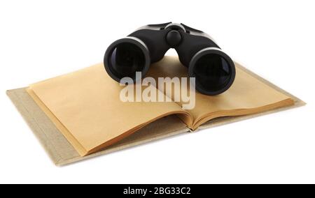 Black modern binoculars with old notebook isolated on white Stock Photo