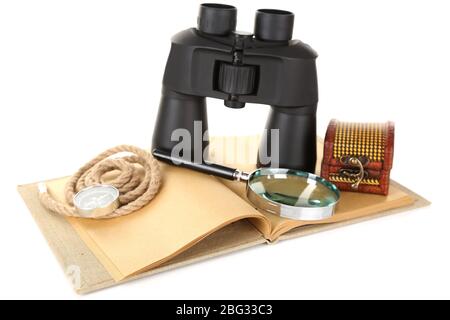 Black modern binoculars with old notebook isolated on white Stock Photo