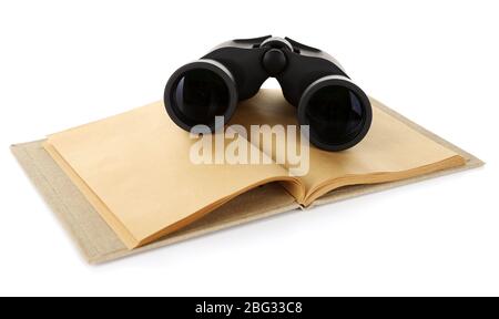 Black modern binoculars with old notebook isolated on white Stock Photo