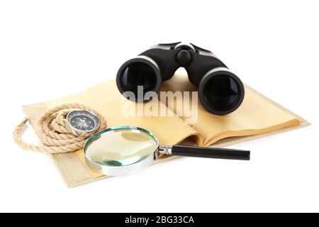 Black modern binoculars with old notebook isolated on white Stock Photo