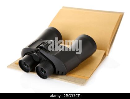 Black modern binoculars with old notebook isolated on white Stock Photo