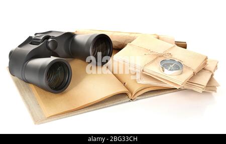 Black modern binoculars with old notebook isolated on white Stock Photo