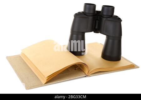 Black modern binoculars with old notebook isolated on white Stock Photo