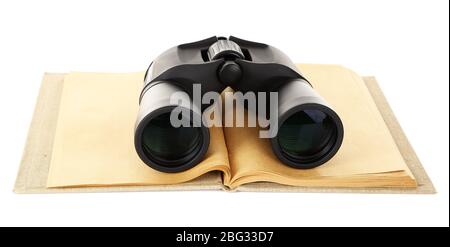 Black modern binoculars with old notebook isolated on white Stock Photo