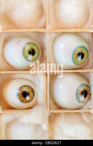 Set of four vintage artificial eyes in a box Stock Photo