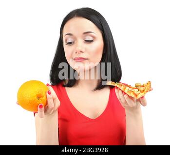 Pretty girl selects pizza or diet isolated on white Stock Photo