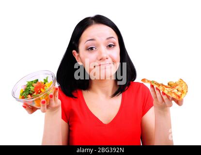 Pretty girl selects pizza or diet isolated on white Stock Photo