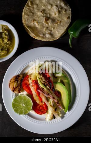 Vegan tacos. Grilled cabbage, onions and red peppers. Stock Photo