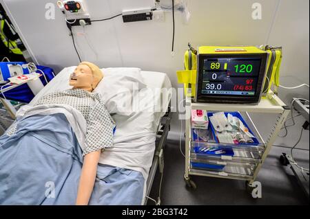 A machine simulating vital signs of a deteriorating patient is used inside a ward as part of medical training at the official opening of the new Dragon's Heart Hospital, built at the Principality Stadium, Cardiff, to care for coronavirus patients. Stock Photo