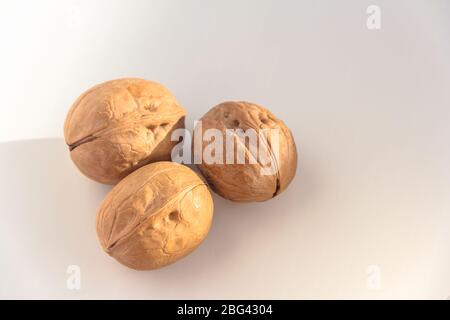 Three Walnuts isolated on a white background. Stock Photo