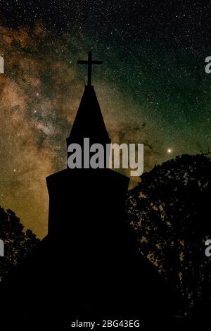 Milky Way galaxy over silhouetted church-Sidney, British Columbia, Canada. Note-Composite image. Stock Photo