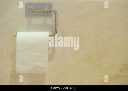 Toilet roll hold wall in the bathroom Stock Photo