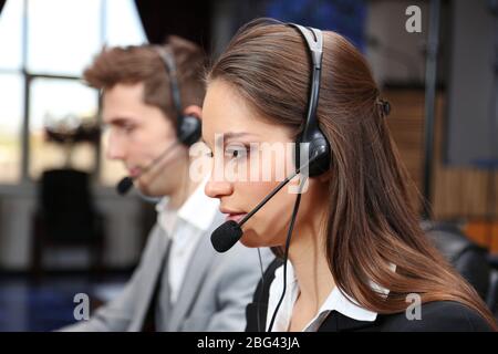 Call center operators at work Stock Photo