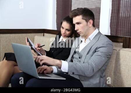 Business people on sofa Stock Photo