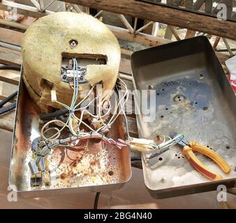 Electrical System of The Broken Steam Iron. An Electrical Iron That Emits Steam to Make Clothes Smooth. Stock Photo