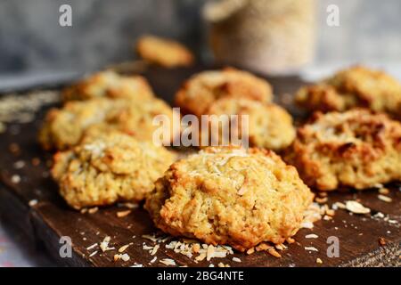 Oatmeal cookies on a wooden background. Close-up. Free space for the test. Healthy homemade cookies. Sweet pastries. Coconut flakes Stock Photo