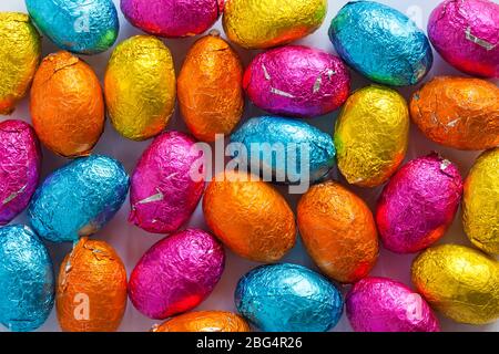 M&S choccy eggs, solid milk chocolate eggs - mini Easter Eggs ready for Easter - foiled solid milk chocolate mini eggs Stock Photo