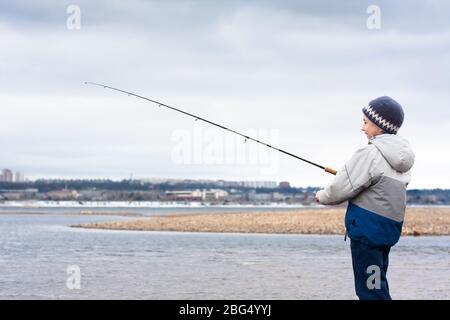 Child Fishing River Lake Young Kid Fisher Summer Outdoor Leisure Stock  Photo by ©Tverdohlib.com 658978974