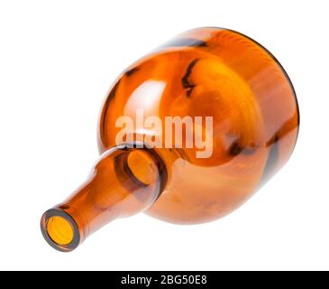 overturned empty wide brown liquor bottle isolated on white background Stock Photo