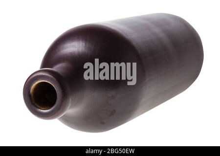 overturned black ceramic bottle isolated on white background Stock Photo