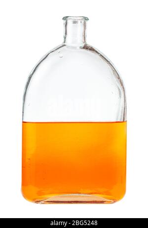 solution of orange watercolour in water in glass flask isolated on white background Stock Photo