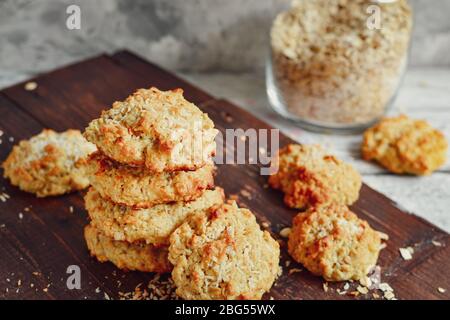 Oatmeal cookies on a wooden background. Close-up. Free space for text. Healthy homemade cookies. Sweet pastries. A stack of oatmeal cookies with Stock Photo