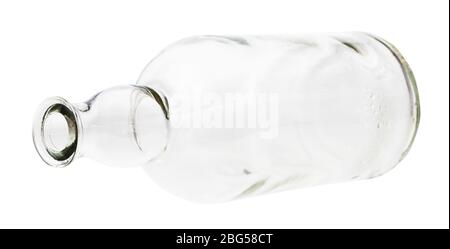 lying empty clear brandy bottle isolated on white background Stock Photo